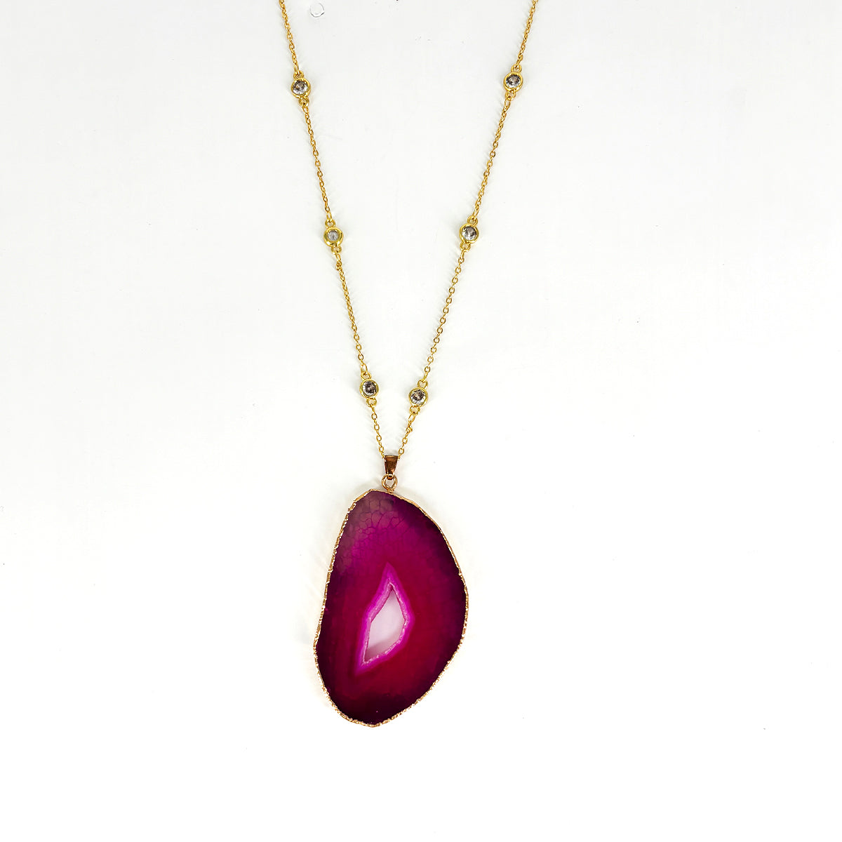 Purple charm in gold toned chain
