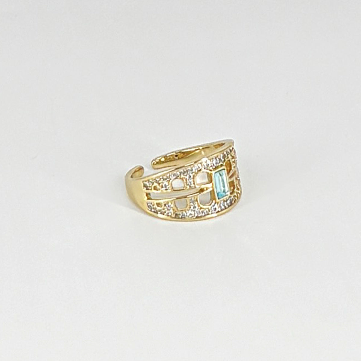 Intricate zircon ring with striking green stone