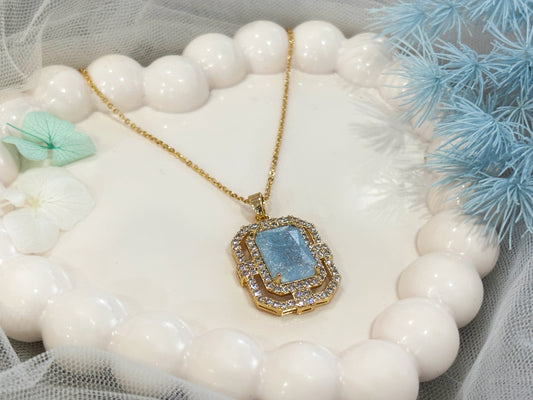 Blue stone and crystal pendant