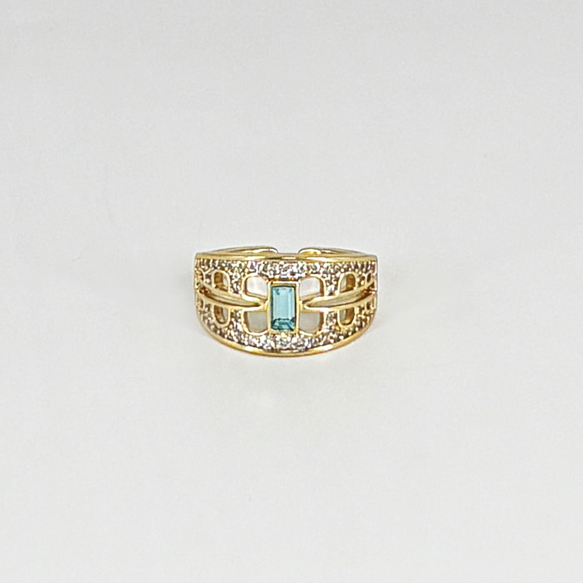 Intricate zircon ring with striking green stone